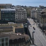 cars on road near buildings during daytime