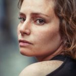 portrait photography of woman wearing black top