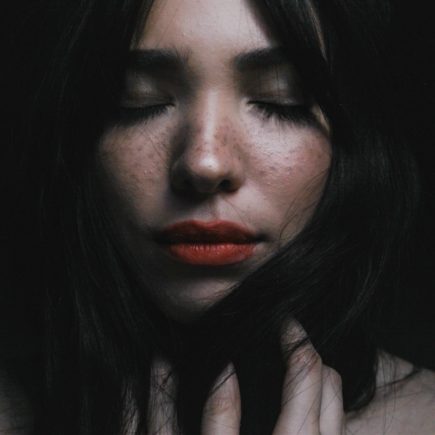 woman touching her hair