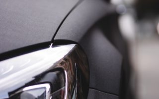black car with black and silver headlight
