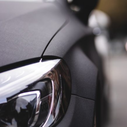 black car with black and silver headlight