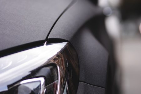 black car with black and silver headlight