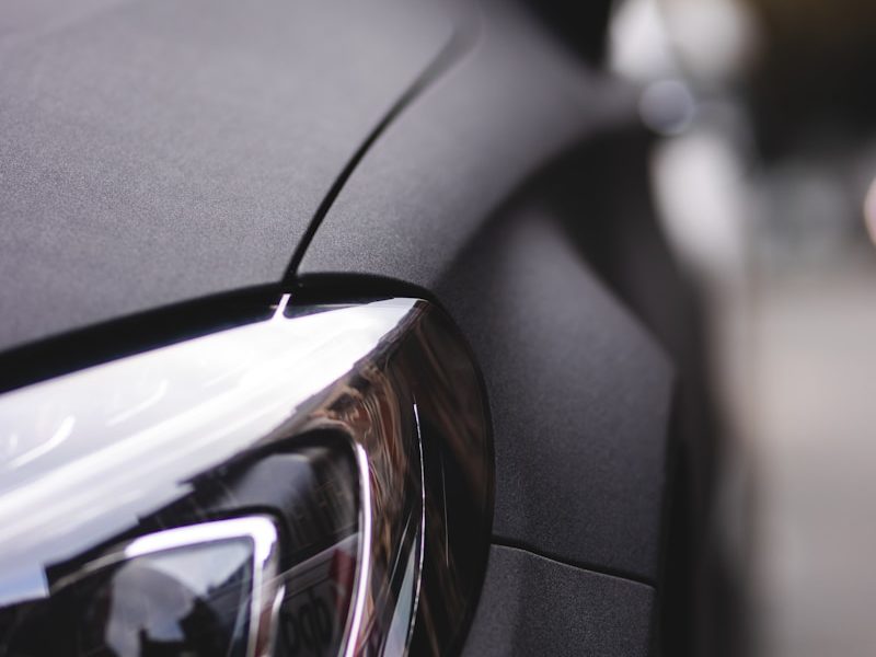 black car with black and silver headlight
