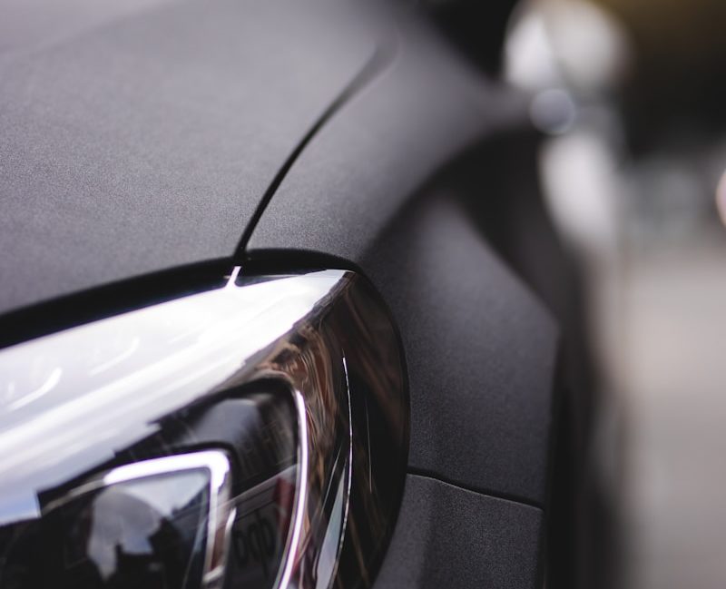 black car with black and silver headlight