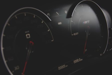 black and gray vehicle cluster panel displaying at 0